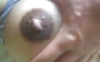 Horny bitch with giant boob and nipples gives him a hand job