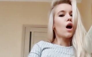 Teen blonde fingering her shaved wet pussy hole